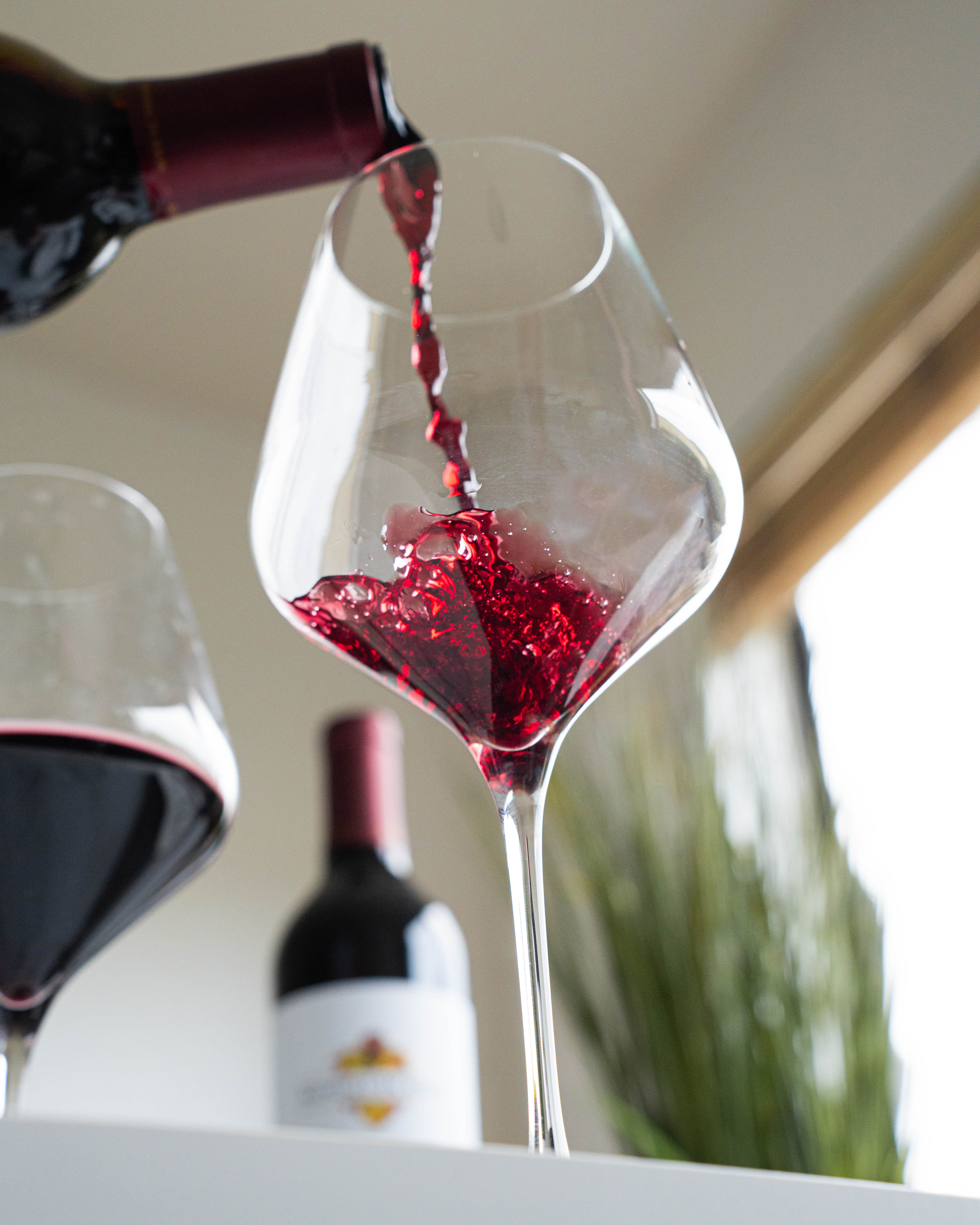 Pouring a glass of red wine Pouring a glass of red wine